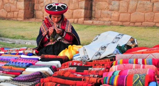 Quechua woman selling textiles